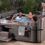 Coronavirus and Hot Tubs: FAQ-Family enjoying a Strong Spas hot tub - image